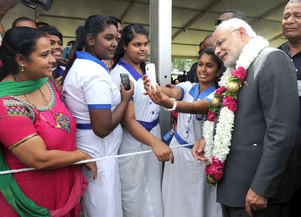 Modi being received on his arrival, at Nausori International Airport