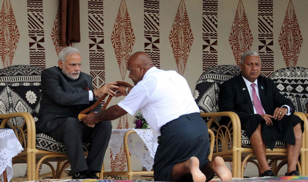 Modi being received on his arrival, at Nausori International Airport