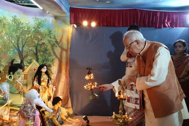  Governor of West Bengal Shri Keshari Nath Tripathi is offering an arati to the Durga idol