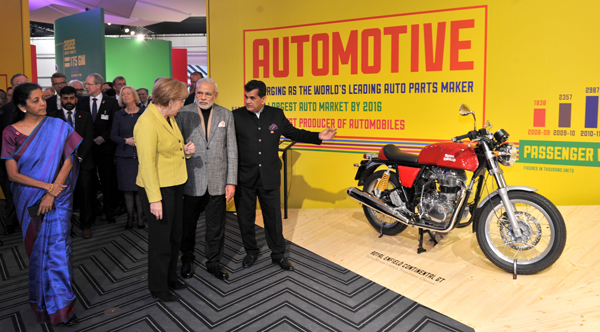 Modi and the German Chancellor, Ms. Angela Merkel at the Joint Inauguration of the India Pavilion and the Joint Walk-About Make in India