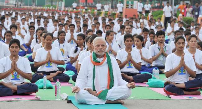PM Modi leads mass yoga demonstration in Delhi on first International Yoga Day