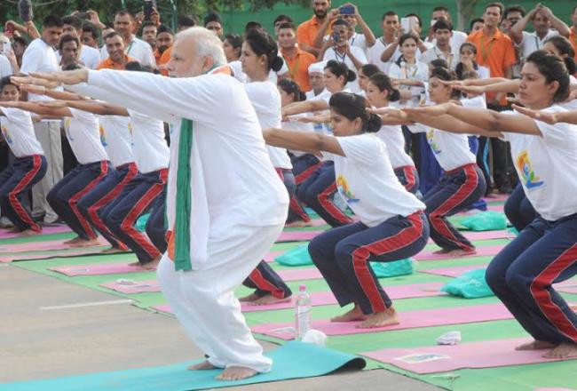 PM Modi leads mass yoga demonstration in Delhi on first International Yoga Day