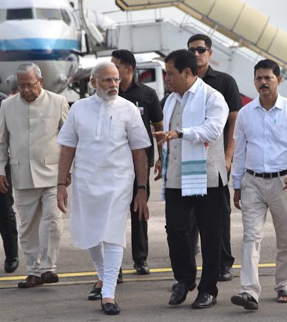 Narendra Modi being received by the Governor of Assam