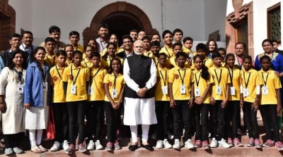 Narendra Modi with a group of underprivileged students