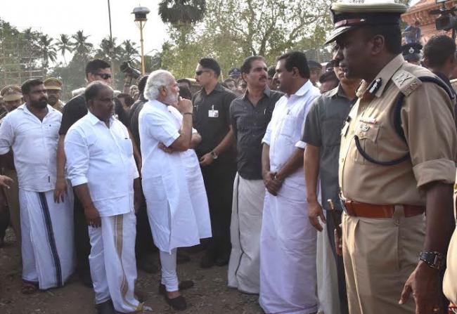 Narendra Modi being received by the Governor of Kerala