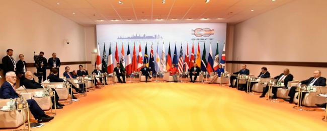 Narendra Modi being welcomed by the German Chancellor