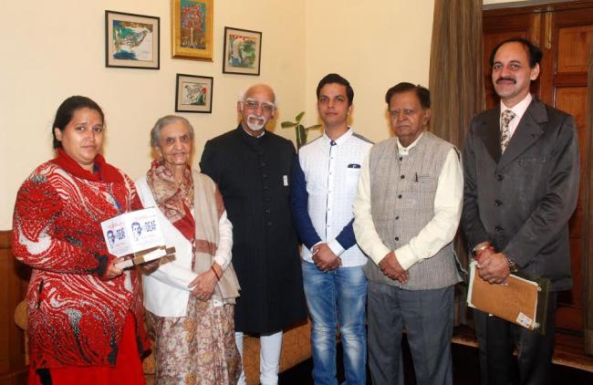  M. Hamid Ansari being presented with the â€˜Flag Stickerâ€™