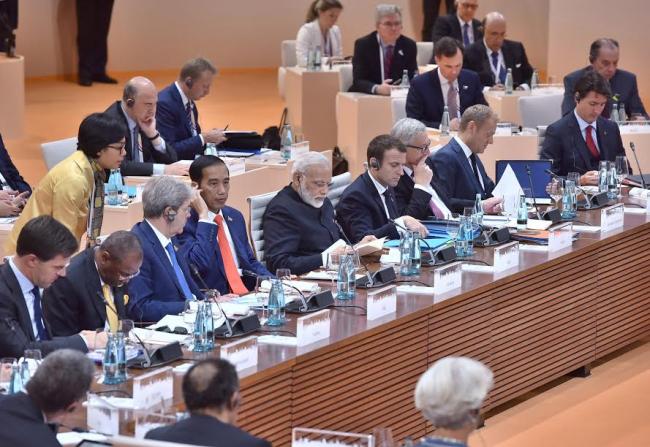 Narendra Modi being welcomed by the German Chancellor