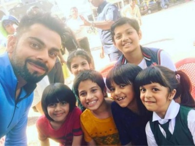 Virat Kohli interacts with kids