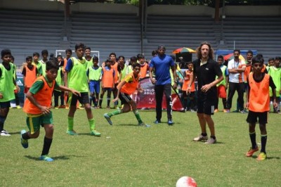 World Cup Winner Carles Puyol plays with school children at Mumbai's  MXIM Festival