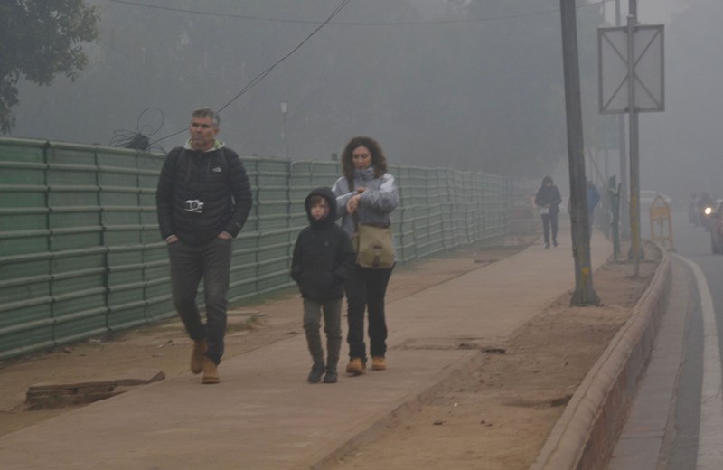 Visitors wrap themselves in warm clothes in New Delhi
