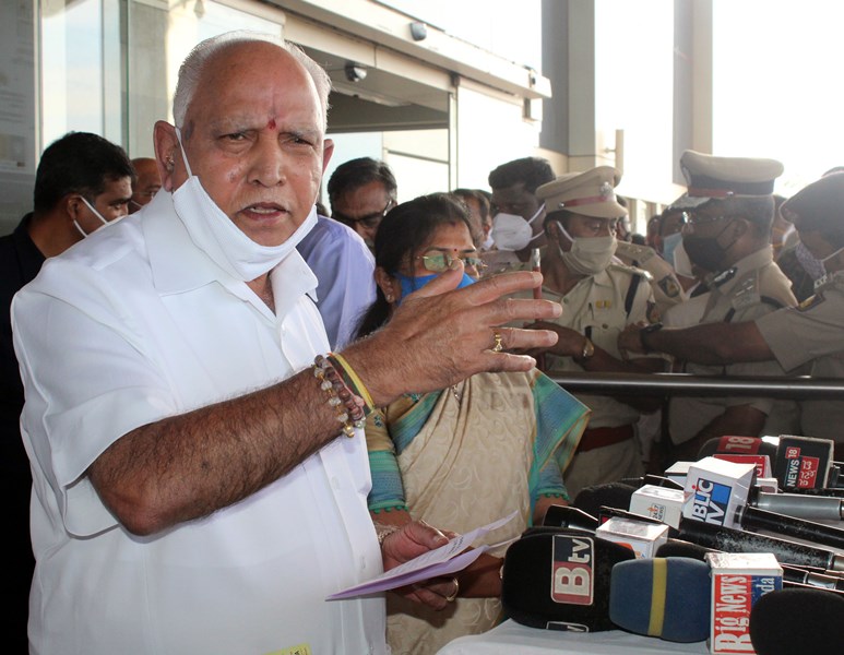 Karnataka CM B S Yeddyurappa speaks to media persons at Sambra Airport in Belagavi