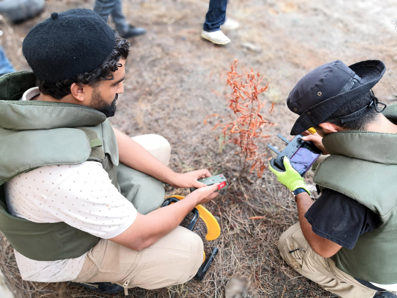 Members of the UN-backed government forces operate the robot to dispose explosives in southern Tripoli