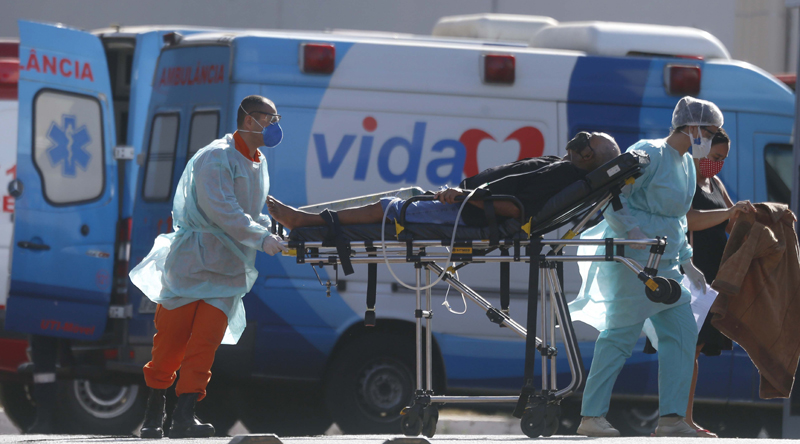 A COVID-19 patient is brought to a hospital by health workers in Brasilia