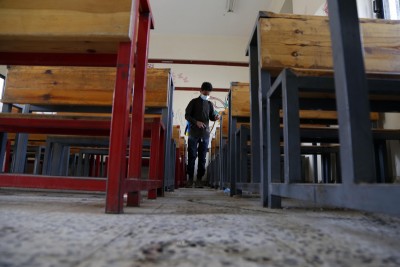 Health worker sanitising classroom in Yemen's capital Sanaa