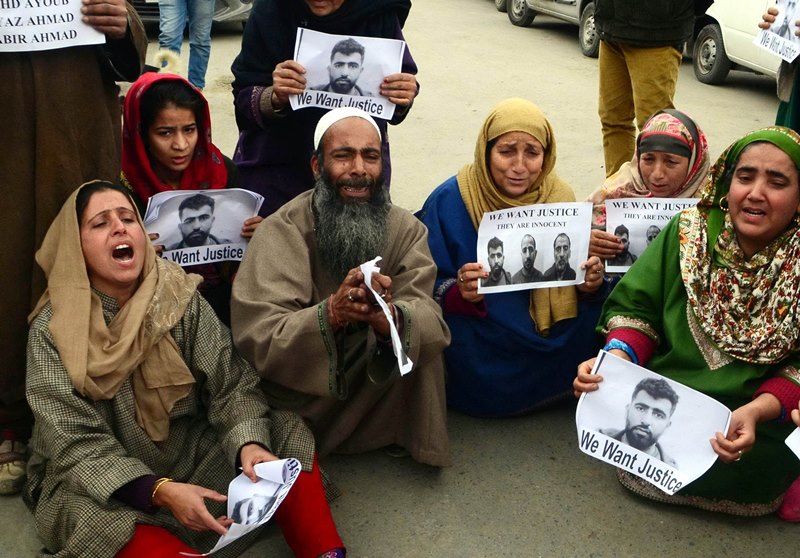 Family members of men arrested by Delhi Police protest in Srinagar