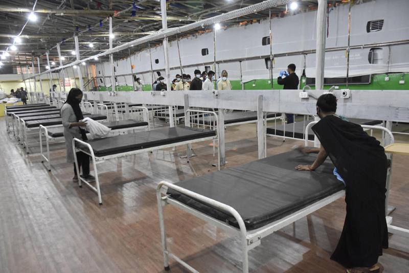 COVID-19: Worker prepares beds at Patliputra Sport Complex