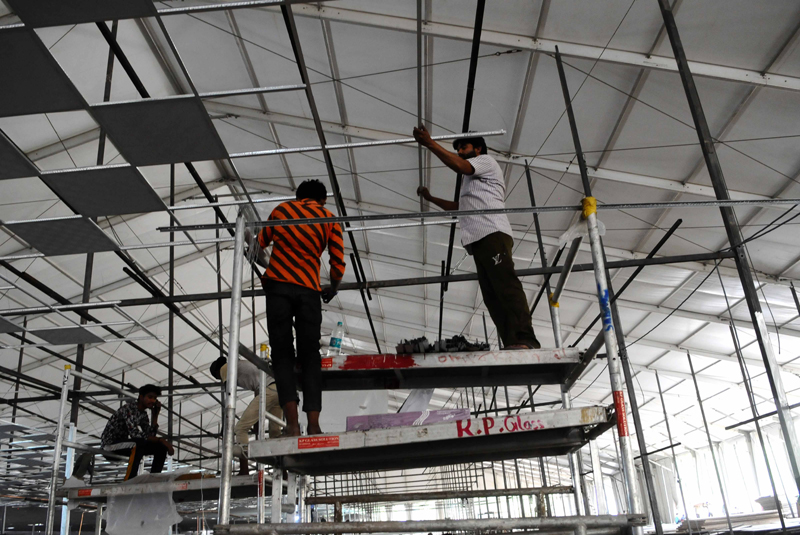 New Delhi: Workers constructing temporary COVID-19 care centre