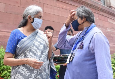 Nirmala Sitaraman and Shashi Tharoor interacts during Monsoon Session