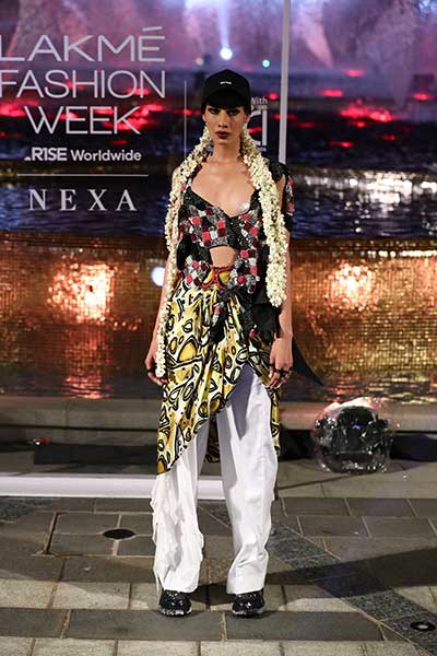 Models showcase designer Anamika Khanna's line of clothing at the Lakme Fashion Week