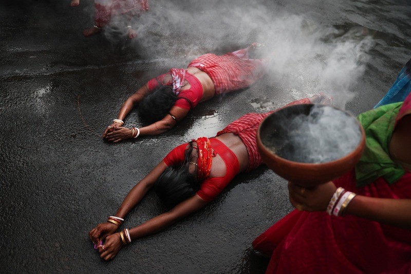 In Images: Devotees worship Goddess Sheetala with fire rituals in Kolkata