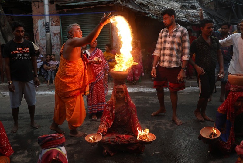 In Images: Devotees worship Goddess Sheetala with fire rituals in Kolkata