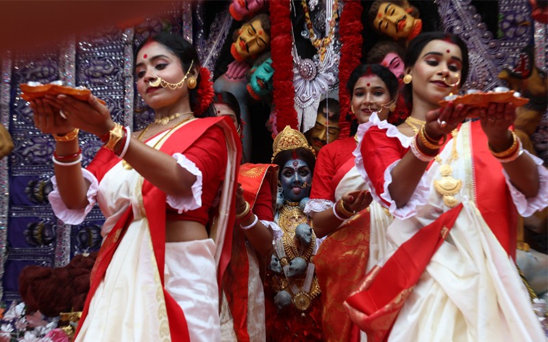 In Images: Dancers perform before Goddess Kali at a pandal in Kolkata