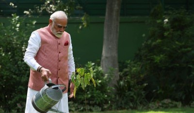 PM Modi plants sindoor sapling at his residence in New Delhi on World Environment Day