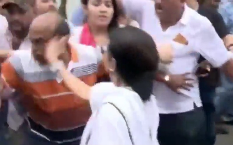 TMC chief Mamata Banerjee slaps her own party worker during a Kolkata protest rally.