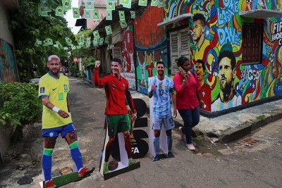 In Images: Children in Kolkata play against the backdrop of a giant World Cup masterpiece