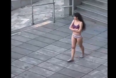 Iranian woman strips down to underwear at university in protest against hijab mandate