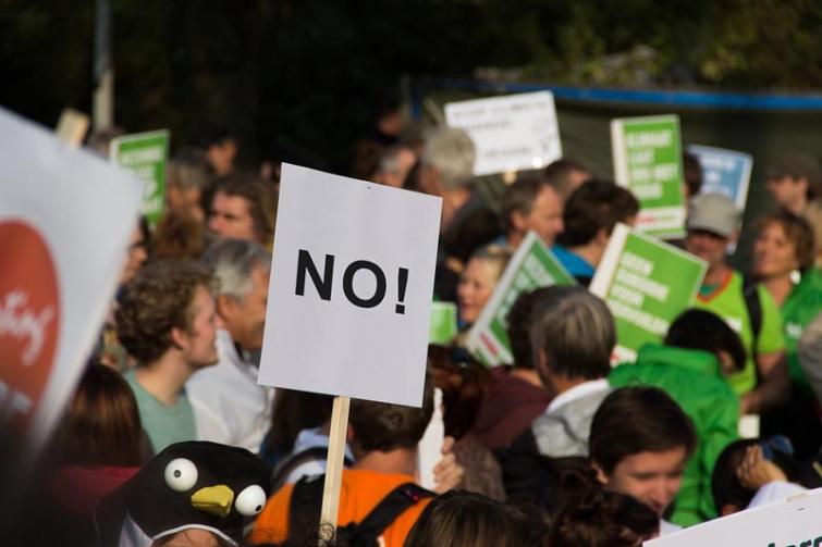 Greenpeace activists protesting deforestation block entry to total's refinery in France