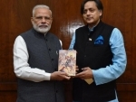 Shashi Tharoor presents copy of his book to PM