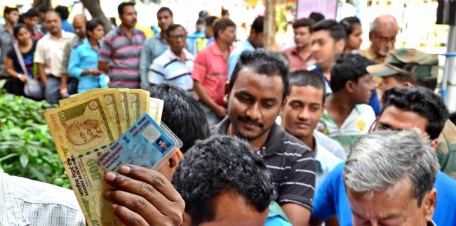 As India runs short of cash, queues grow longer outside banks