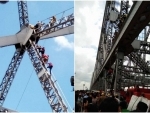 Kolkata: Mentally challenged man climbs up Howrah Bridge, rescued unhurt