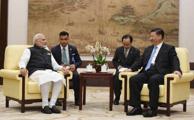 Narendra Modi, Xi Jinping meet in Wuhan, exchange views on solidifying bilateral relationship