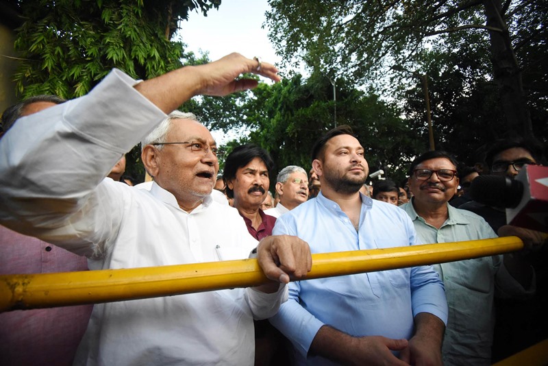 Nitish Kumar along with RJD leader Tejashwi Yadav coming out after meeting with Governor, in Patna on Tuesday / UNI.