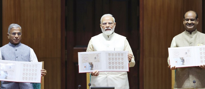 PM Modi unveils commemorative stamp and Rs 75 coin to mark the inauguration of new Parliament building