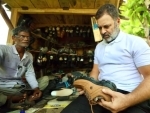 Rahul Gandhi stops at a cobbler's shop on his way back to Lucknow