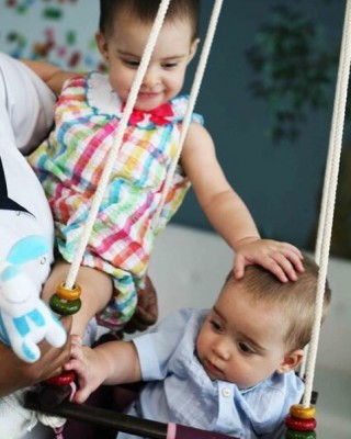 Karan Johar shares cute image of his twins where Roohi is busy loving brother Yash