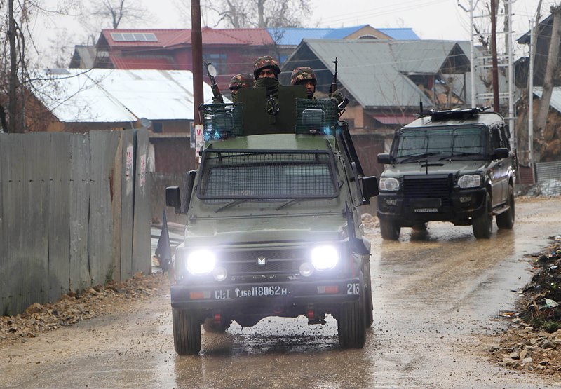 Security personnel flash victory sign after eliminating two LeT terrorists in J&K's Kulgam