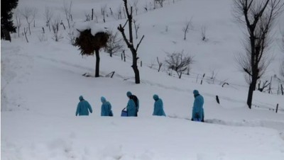 Kashmir's health workers enter snow bound areas to provide vaccines