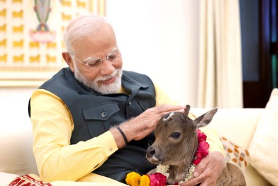 PM Modi welcomes new member Deepjyoti at his residence