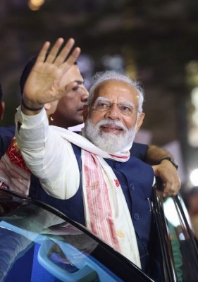 PM Modi waves at crowd in Guwahati