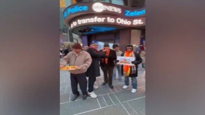 'Overseas Friends Of Ram Mandir' members distribute laddoos at Times Square ahead of consecration ceremony of Ram Temple in Ayodhya