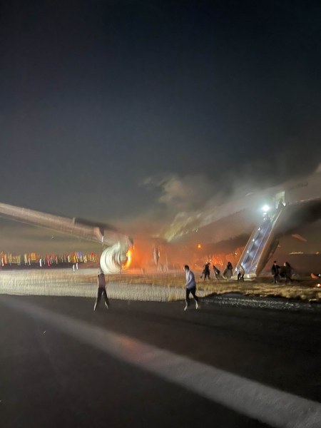 Japan Airlines flight catches fire after landing at Tokyo's Haneda Airport