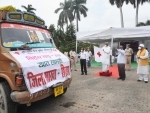 Bihar governor Fagu Chauhan flags off the trucks loaded with relief materials