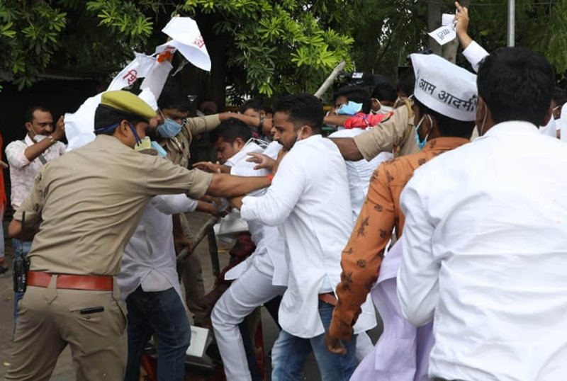 Police detain Aam Admi Party (AAP) workers during protest against the NEET- JEE examination