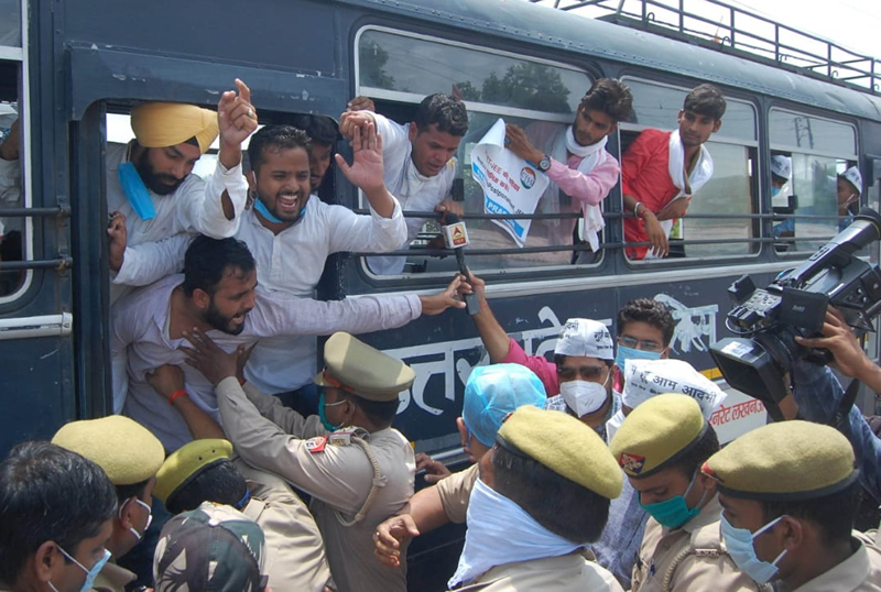 Police detain Aam Admi Party (AAP) workers during protest against the NEET- JEE examination