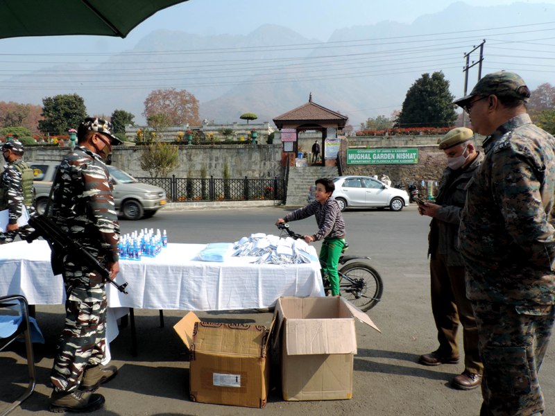 CRPF jawans provides face masks and sanitizer to the local tourists in Srinagar